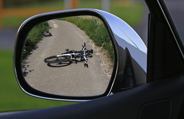 Rider of this bike on the road in rearview mirror wonders what should I do if I get hit by a car on my bike